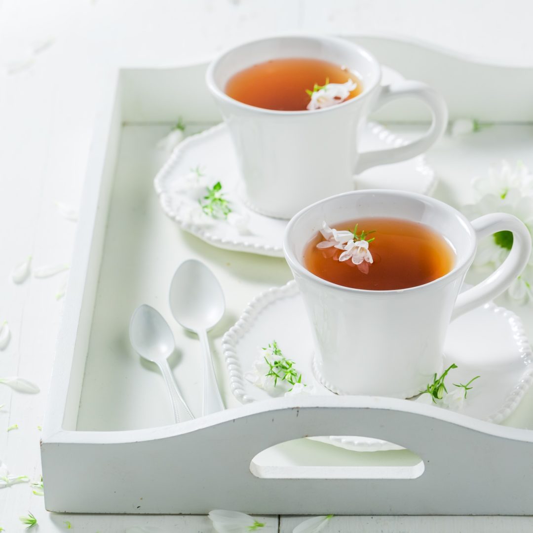 Fresh tea with honey with spring flowers