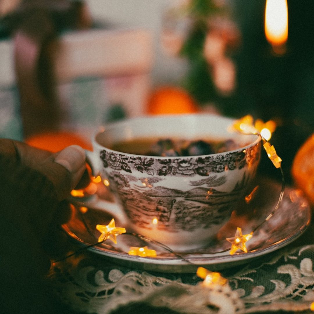 a cup of tea on a saucer on a table